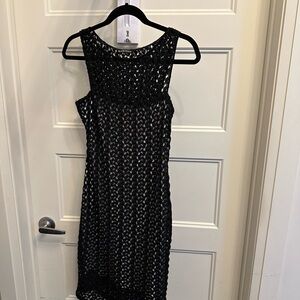 Trendy Black knit dress with cream slip.